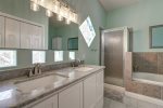 Upstairs master ensuite, dual vanities, shower, and jetted tub